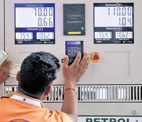 A fuel station in Bengaluru displays new prices after the rates of petrol and diesel were hiked on Friday.