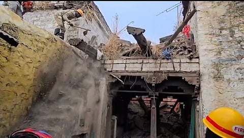 Fire and Emergency trying to clear debris of the collapsed house in Moratagi village on Friday.