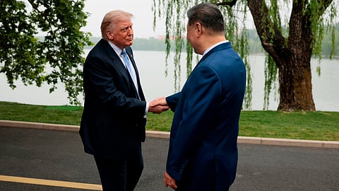 U.S. President Donald Trump, left, shakes hands with Chinese President Xi Jinping at Zhongnanhai Garden in Beijing, China, Friday, May 15, 2026.