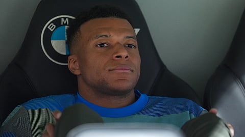 Real Madrid's Kylian Mbappe looks out from the bench prior to the Spanish La Liga football match between Real Madrid and Real Oviedo in Madrid, Spain, Thursday, May 14, 2026.