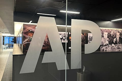 The Associated Press logo is displayed at the news organization’s world headquarters in New York on April 9, 2025.