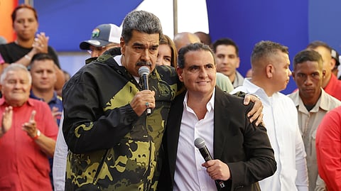 FILE - Venezuela's President Nicolas Maduro, left, and Alex Saab stand together during an event marking the anniversary of the 1958 coup that overthrew dictator Marcos Perez Jimenez, in Caracas, Venezuela, Jan. 23, 2024.