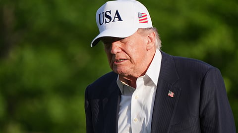 President Donald Trump walks across the South Lawn of the White House, Friday, May 15, 2026, in Washington, on return from Beijing where he met with China's President Xi Jinping.