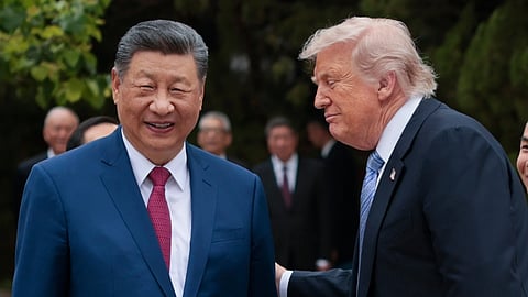 US President Donald Trump, right, speaks with Chinese President Xi Jinping while leaving after a visit to the Zhongnanhai Garden in Beijing, Friday, May 15, 2026.
