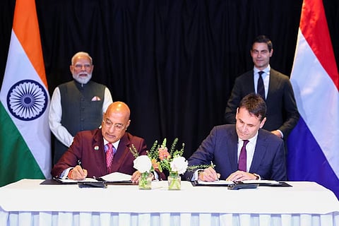 Tata Electronics CEO Randhir Thakur and ASML CEO Christophe Fouquet sign a Memorandum of Understanding as Indian Prime Minister Narendra Modi and Dutch Prime Minister Rob Jetten look on at The Hague on Saturday