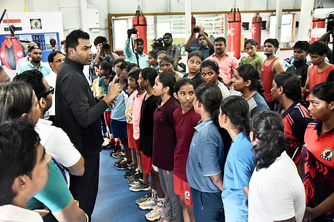 Aadhav Arjuna (L) interacts with students on Monday