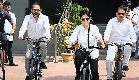 Justice Savitri Ratho (middle), Justice Sibo Sankar Mishra (left) and Justice V Narasingh (right) ride bicycles to the High Court on Monday