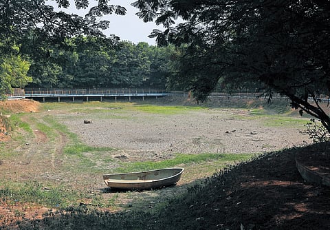 The man-made lake in the Public Garden in Hyderabad is seen completely dried up amidst severe summer heat on Tuesday.