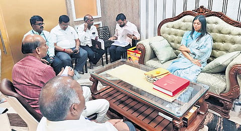 MLA Kanimozhi Santhosh seated on a sofa while corporation health officials occupied chairs during a meeting at her “astrology office”