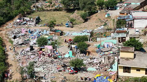A view of demolished structures following an anti-encroachment drive conducted by Forest Department and the police to clear alleged illegal settlements on the forest lands surrounding the lower side of Mahamaya Temple, in Jammu, Jammu and Kashmir, Tuesday, May 19, 2026.