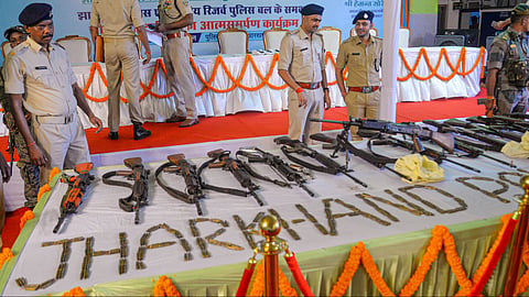 Arms and ammunition surrendered by 27 Maoists are displayed during an event after their surrender, in Ranchi, Jharkhand, Thursday, May 21, 2026.