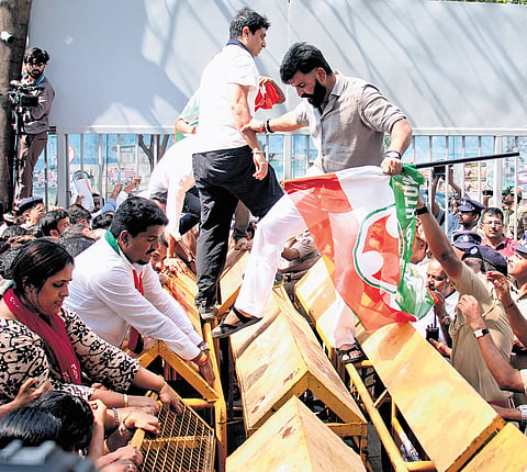 Karnataka Youth Congress chief Manjunath Gowda leads the party members during the protest against the NEET paper leak, in Bengaluru on Thursday.