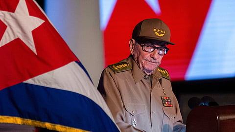 Former Cuban President Raul Castro looks at the Cuban flag during his speech at the event celebrating the 65th anniversary of the triumph of the revolution in Santiago, Cuba, Jan. 1, 2024.