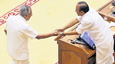 Leader of Opposition Pinarayi Vijayan greets Chief Minister V D Satheesan in the state assembly in Thiruvananthapuram on Thursday after taking oath.