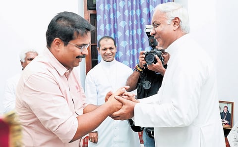 Thiruvananthapuram Archbishop Thomas J Netto welcoming Fisheries Minister V E Abdul Gafoor at the Latin Archbishop House on Friday. Auxiliary Bishop Christudas R is also seen
