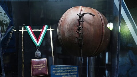 A soccer ball and a medal from 1902 are on display at the Football Museum in Pachuca, Hidalgo state, Mexico, Thursday, May 14, 2026.