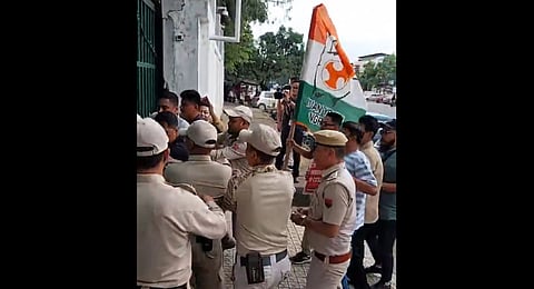 Manipur Youth Congress workers clash with police as they protest outside the chief minister's residence in Imphal on Saturday, May 23, 2026.