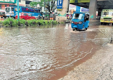 An inundated road near Kaloor bus stand following the rain on Saturday