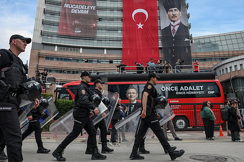 Police officers arrive at Turkey's main opposition Republican People's Party (CHP) headquarters in Ankara, Sunday, May 24, 2026, to evict supporters gathered inside.