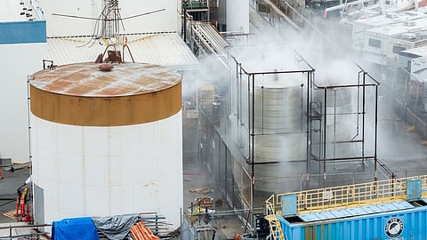 Water is sprayed on a damaged tank at GKN Aerospace in Garden Grove, Calif., on Sunday, May 24, 2026, after the tank containing a chemical used to make plastic parts overheated Thursday.