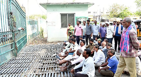 Maize farmers lock the gates of the Karimnagar Agricultural Market on Monday to protest falling prices and procurement delays.