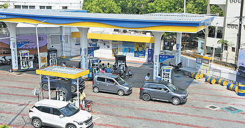 Vehicles line up at a petrol bunk in Tiruchy on Monday.