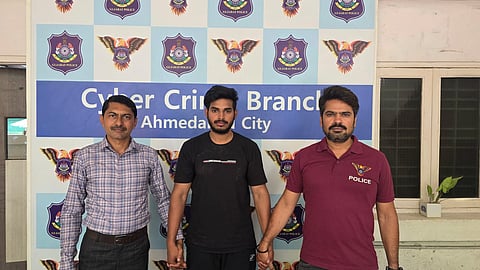 Arrested individual (Centre)