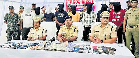 The accused and the seized items being presented before the media