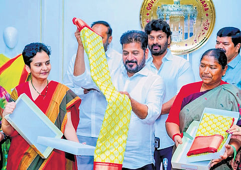 Chief Minister A Revanth Reddy releases the designs of Indiramma sarees to be distributed to women’s groups.