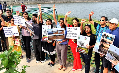 Members of Voice of Sadashivanagar hold a demonstration to raise awareness as part of Save Sankey Lake movement in Bengaluru on Sunday.