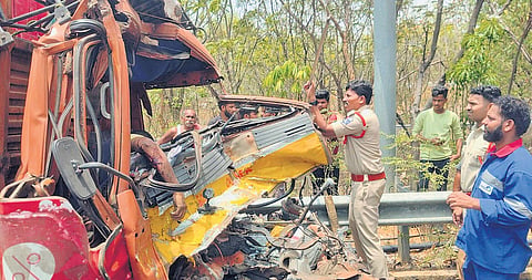 Police oversee the recovery of the mangled remains of the vehicles involved in the accident near Shamirpet on Monday.