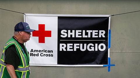 An American Red Cross volunteer walks outside Freedom Hall, an evacuation center in Fountain Valley, Calif.,on Monday, May 25, 2026