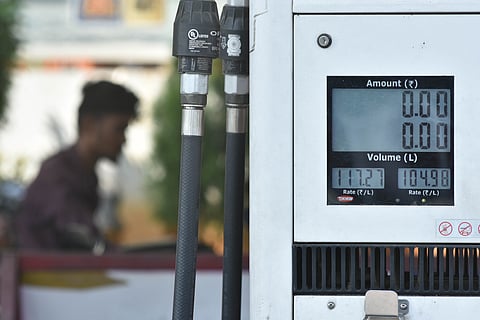 People fill petrol after increase of Rs 2.84 on petrol and Rs 2.86 on diesel at a filling station in Vijayawada on Monday.
