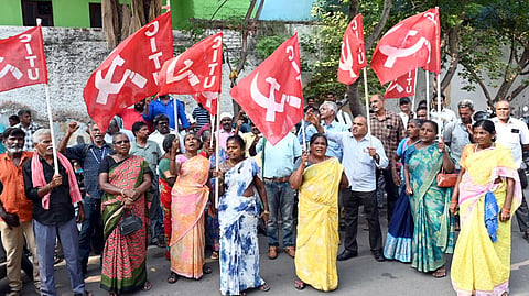 Sanitary workers staging a protest at Thiruvottiyur zonal office.