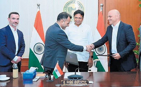 Regeneron V-P Bari Kowal and Telangana Life Sciences CEO Sarvesh Singh exchange MoUs in the presence of IT Minister D Sridhar Babu