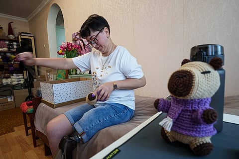 Iryna Nakonechna knits a toy capybara at her home in Kryvyi Rih, Ukraine, Saturday, May 9, 2026.