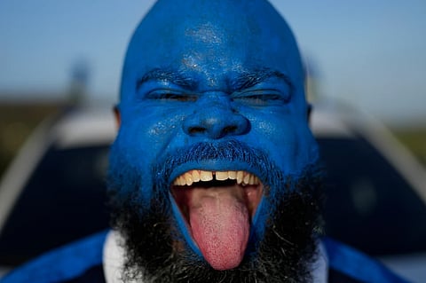 Brenton Balentien, known as Blue Face, a leader of soccer fans of Curacao’s national soccer team, cheers in Willemstad, Saturday, May 16, 2026.