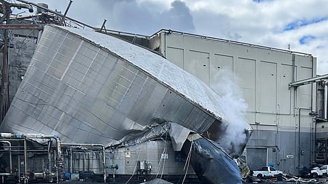 This photo provided by the City of Longview, Wash., shows structural damage to the Nippon Dynawave Packaging Co., after a tank containing hazardous liquid imploded, on Tuesday, May 26, 2026 in Longview, Wash.