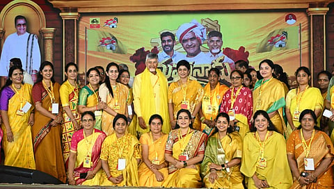 CM Nara Chandrababu Naidu poses for a picture with the women cadre and leader of the party during Mahanadu programme at the TDP central party office in Mangalagiri on Wednesday.
