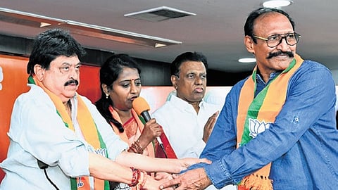 State BJP president N Ramchander Rao welcomes retired IRS officer A Sudhakar Reddy into the saffron party