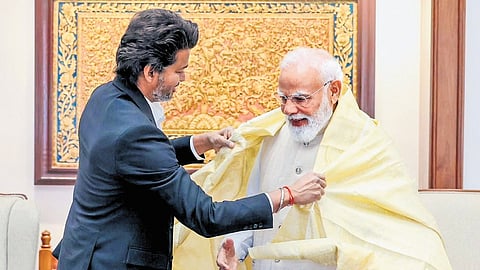 Chief Minister C Joseph Vijay honours Prime Minister Narendra Modi with a shawl during their meeting in New Delhi on Wednesday.