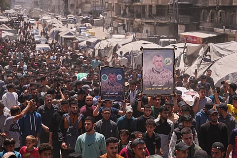 Palestinians attend the funeral of Izz al-Din al-Haddad, the leader of Hamas' Qassam Brigades, and his daughter and wife in Gaza City, Saturday, May 16, 2026. They were killed in an Israeli strike Friday evening.