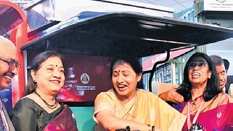 Chief Secretary Shalini Rajneesh tries to ride an electric vehicle at the three-day Global MSME Conclave 2026 at Palace Grounds in Bengaluru on Friday