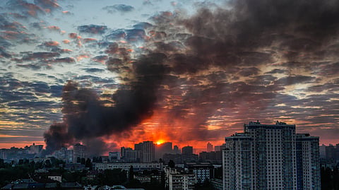 Smoke rises in the aftermath of a Russian attack in Kyiv, Ukraine, on Sunday, May 24, 2026.