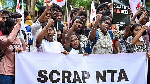 Students' Federation of India (SFI) members take out a protest rally against the National Testing Agency (NTA) over the alleged paper leak concerns following the cancellation of the NEET-UG 2026 examination.