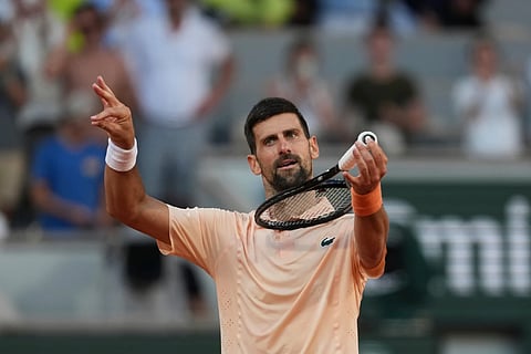 Novak Djokovic of Serbia celebrates after winning against Valentin Royer of France during their second round men's singles tennis match at the French Open tennis tournament in Paris, Wednesday, May 27, 2026.