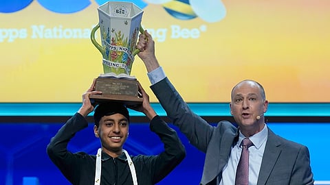 EW Scripps Company president and CEO Adam Symson, right, holds the trophy over winner of the 2026 Scripps National Spelling Bee, Shrey Parikh, 14, of Rancho Cucamonga, Calif., at DAR Constitution Hall, Thursday, May 28, 2026, in Washington.