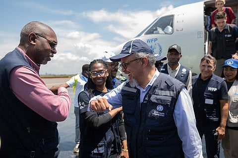 Director General of the World Health Organisation (WHO) Tedros Adhanom Ghebreyesus, right, is welcomed at Bunia airport in Bunia.