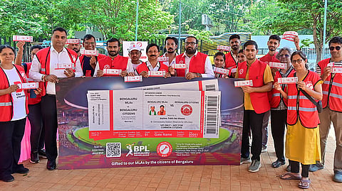 The members of the Bengaluru NavaNirmana Party unveil a mock ‘VIP IPL Ticket’ urging the state government to end Bengaluru’s ‘toxic VIP culture,’ in Bengaluru on Friday.