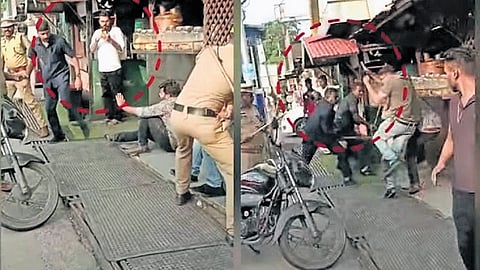 Screengrab of the security officials hitting protesting youth Cong and KSU leaders